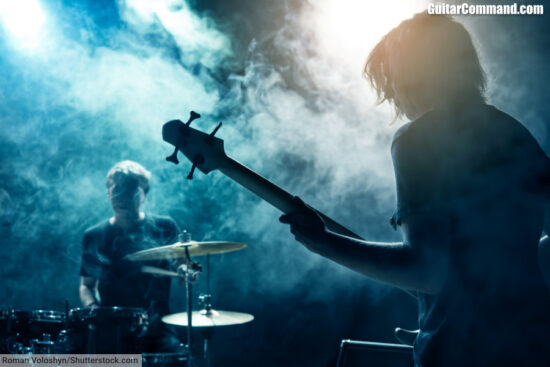 Rock Band Rehearsing Playing Bassist And Drummer